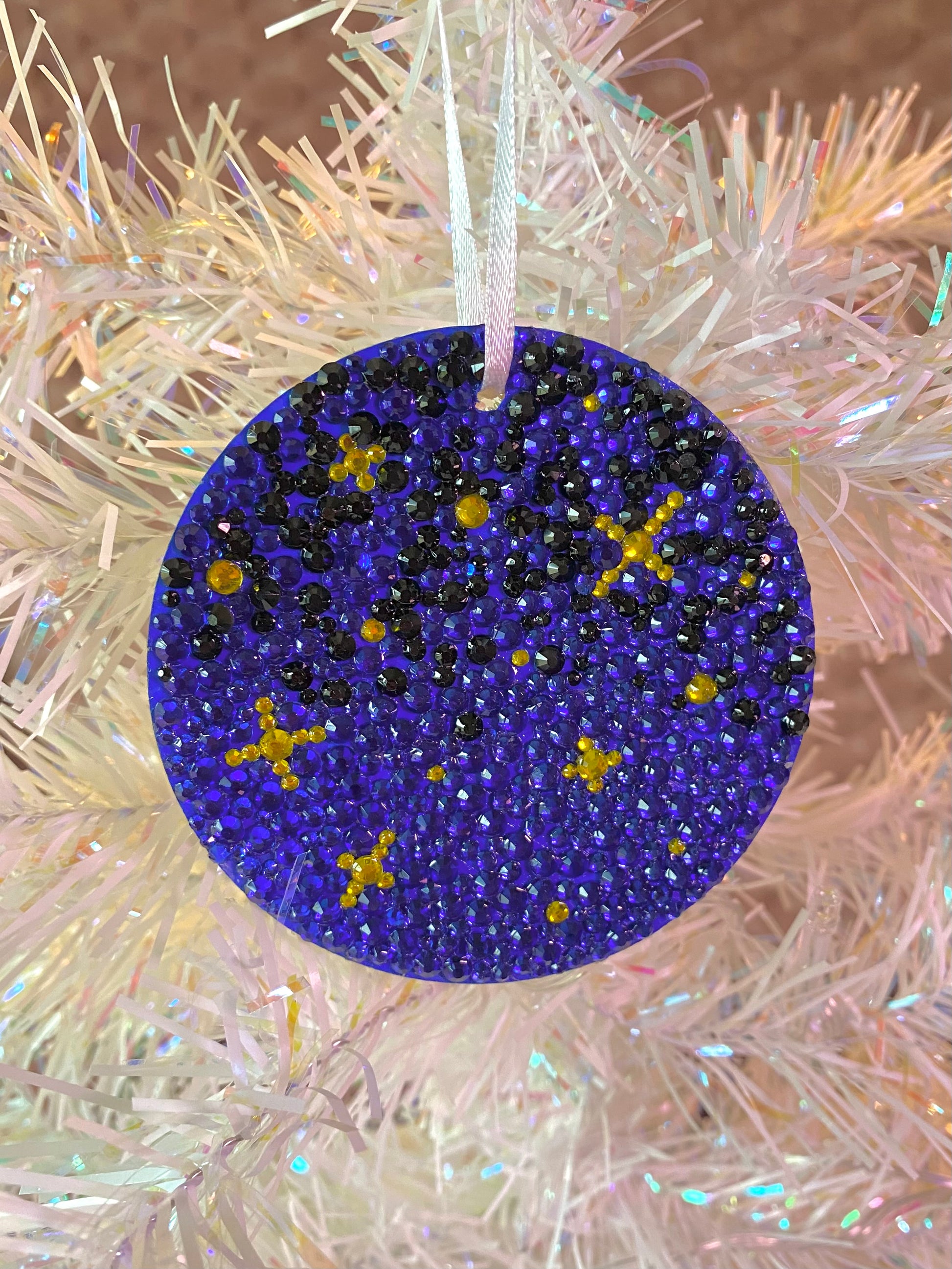 blue and black gems with yellow stars