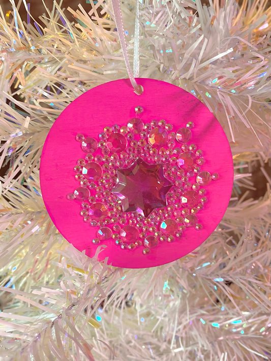 pink round ornament with pink gemstones